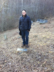 Here I am standing at the Ward Brumfield grave, located in Harts. Around 2002, I helped to write a grant and placed a modern tombstone at Ward's grave, which was previously marked with a rock. Ward appears as a child in my book, "Blood in West Virginia: Brumfield v. McCoy."